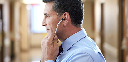 Doctor incorrectly putting on Littmann stethoscope with eartips facing back.
